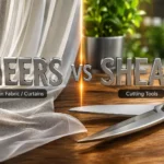 3D comparison of sheers and shears, showing sheer curtains on one side and shiny cutting shears on the other.